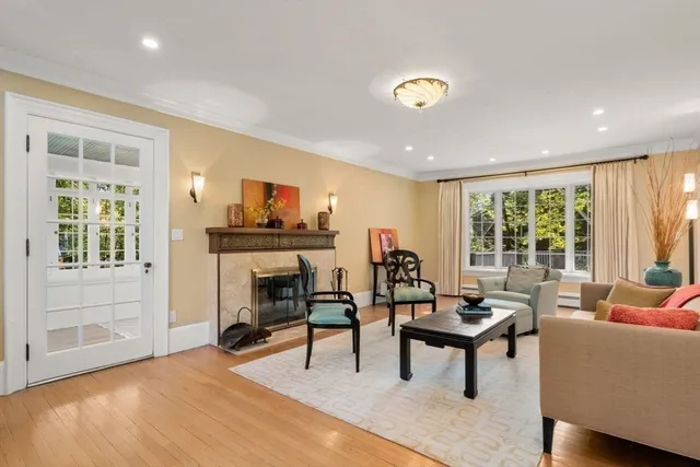 a living room with furniture and a fireplace