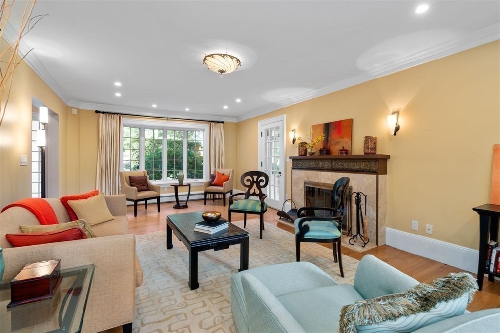 1430 Beacon Street Newton, MA 02468 - Photo 5 of 38 a living room with furniture and a fireplace