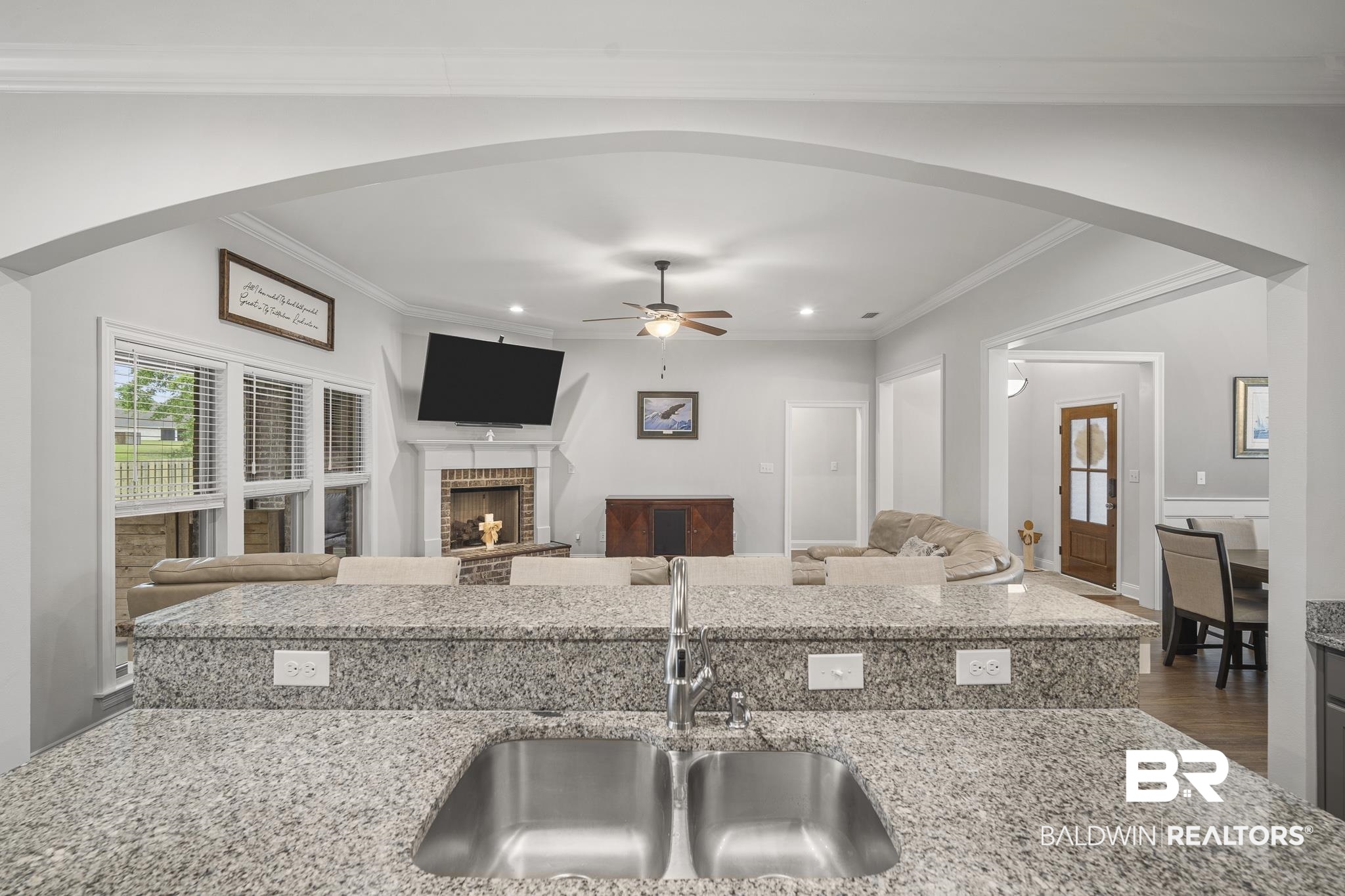 12672 Squirrel Drive Daphne, AL 36527 - Photo 13 of 49 Kitchen island with granite-finish countertop and stainless steel double basin sink
