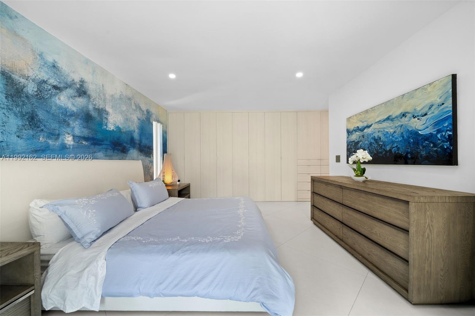 7531 Southwest 52nd Court Miami, FL 33143 - Photo 19 of 56 a bedroom with a bed and a painting on the wall