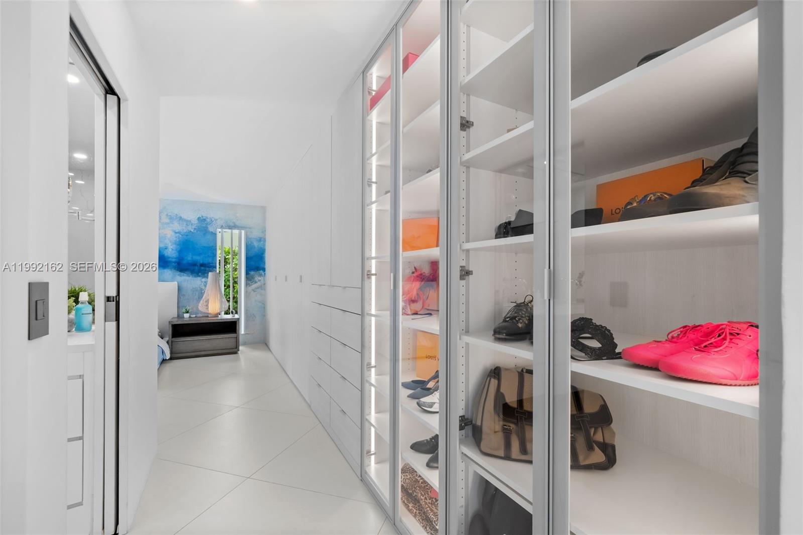 7531 Southwest 52nd Court Miami, FL 33143 - Photo 20 of 56 a view of walk in closet with clothes and shoes