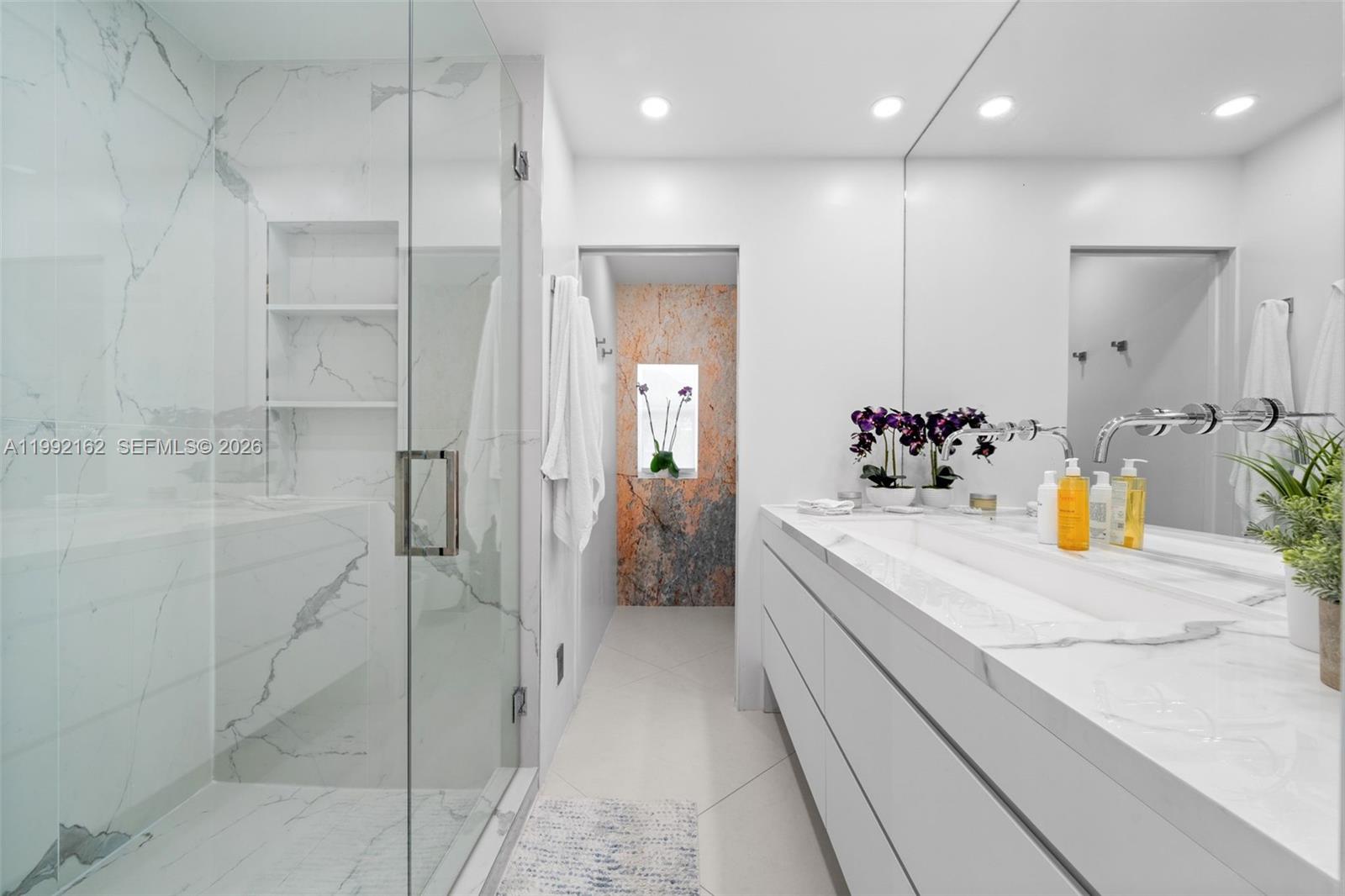 7531 Southwest 52nd Court Miami, FL 33143 - Photo 21 of 56 a bathroom with a sink a shower and a mirror
