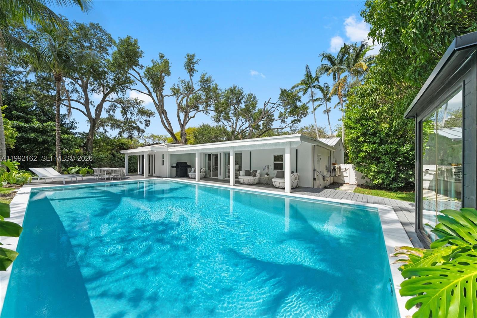 7531 Southwest 52nd Court Miami, FL 33143 - Photo 24 of 56 a view of a house with backyard and sitting area