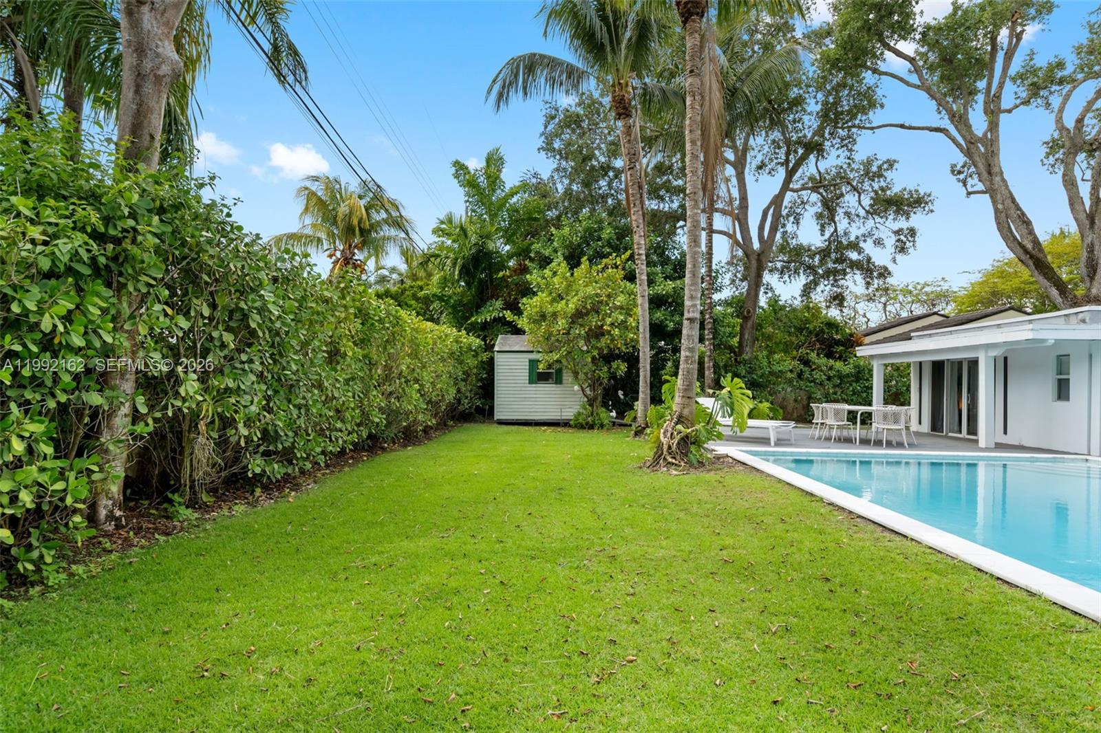7531 Southwest 52nd Court Miami, FL 33143 - Photo 25 of 56 a view of a house with backyard and sitting area