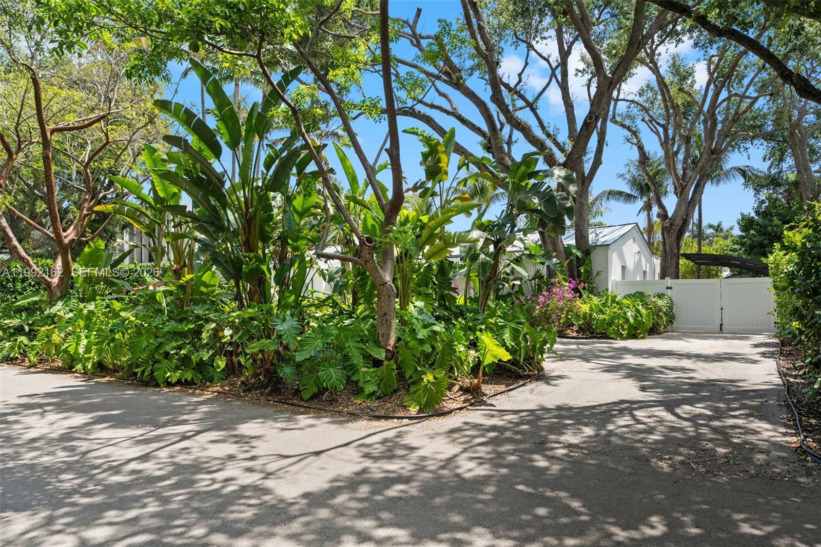 7531 Southwest 52nd Court Miami, FL 33143 - Photo 27 of 56 a sidewalk with a tree in front of it