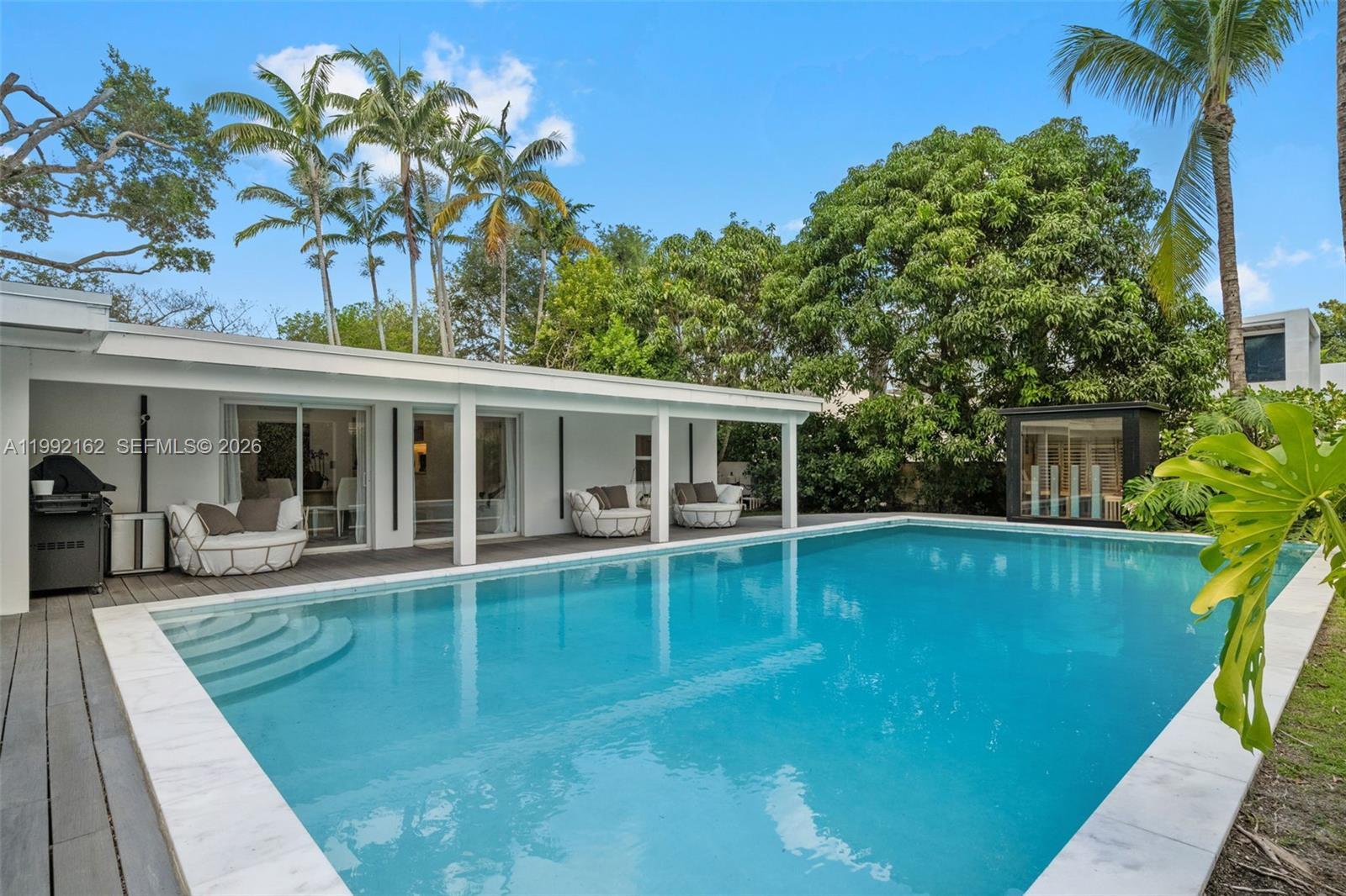 7531 Southwest 52nd Court Miami, FL 33143 - Photo 43 of 56 a view of a house with a swimming pool