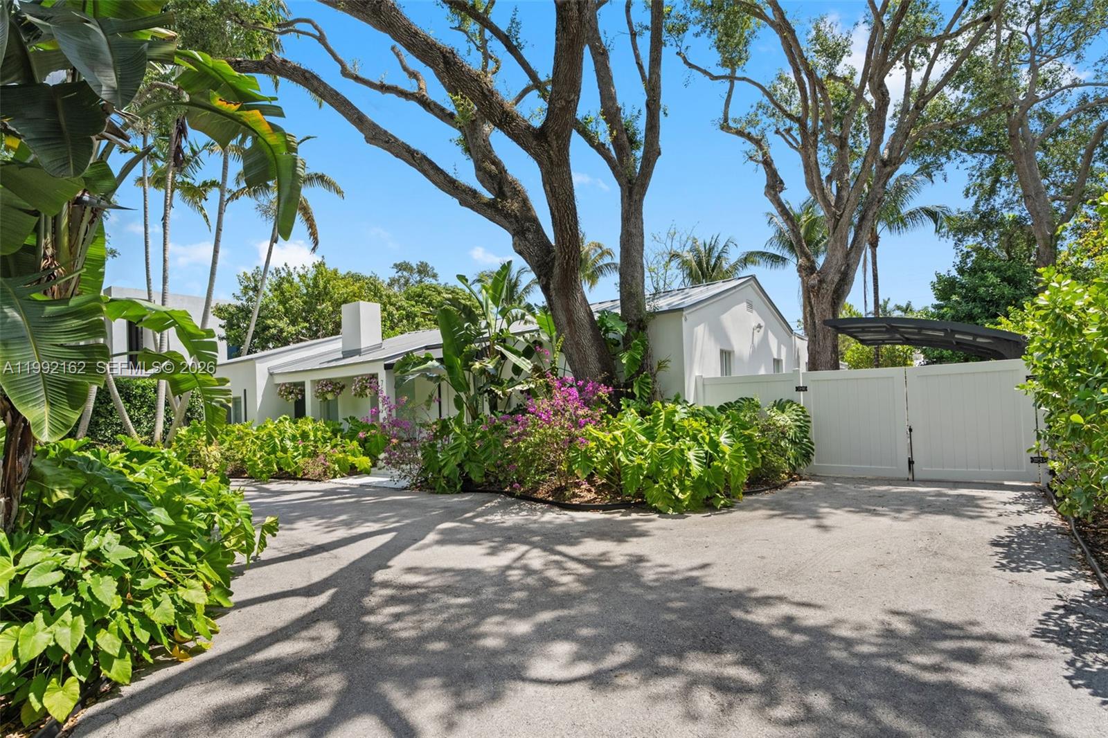 7531 Southwest 52nd Court Miami, FL 33143 - Photo 6 of 56 a front view of a house with garden