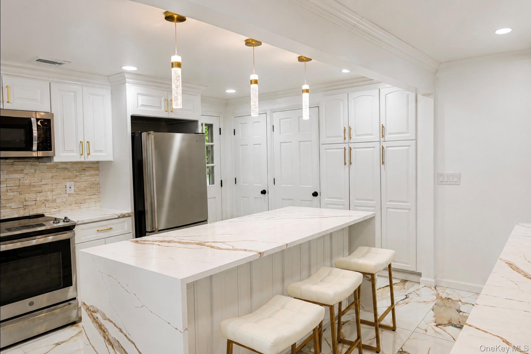 80 Mt Pleasant Road Smithtown, NY 11787 - Photo 3 of 27 a large kitchen with a table and chairs