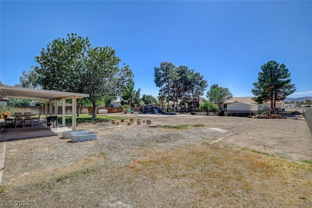 3765 Berkeley Street Logandale, NV 89021 - Photo 70 of 87 This spacious backyard offers a covered patio perfect for outdoor entertaining.