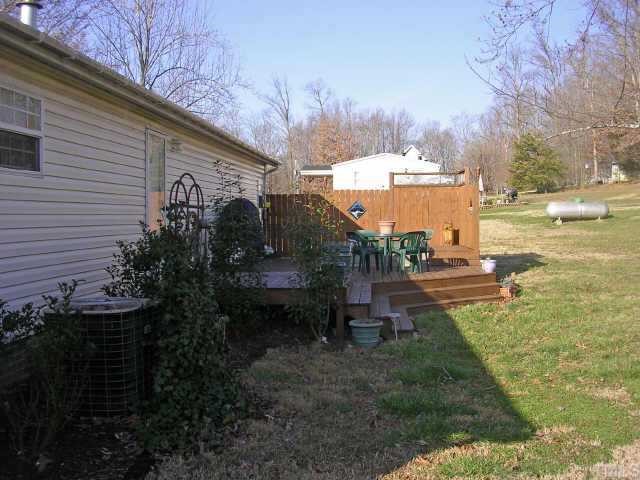 1707 Cedar Grove Church Road Roxboro, NC 27574 - Photo 2 of 9 Rear view of home showing 2 tiered decking, hot tub and privacy fence.