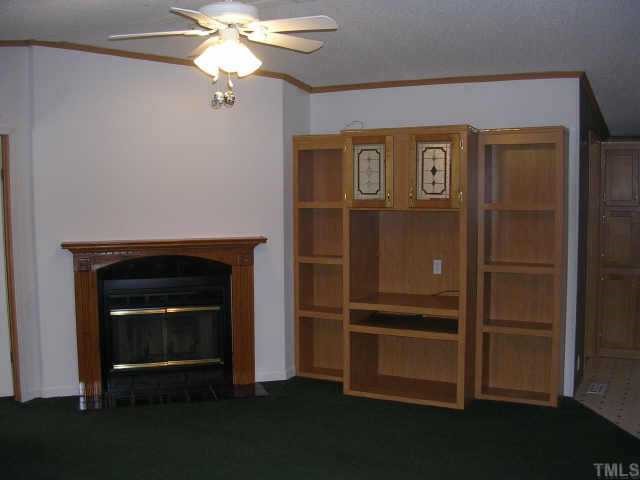1707 Cedar Grove Church Road Roxboro, NC 27574 - Photo 4 of 9 Another view of living area showing fireplace and entertainment center