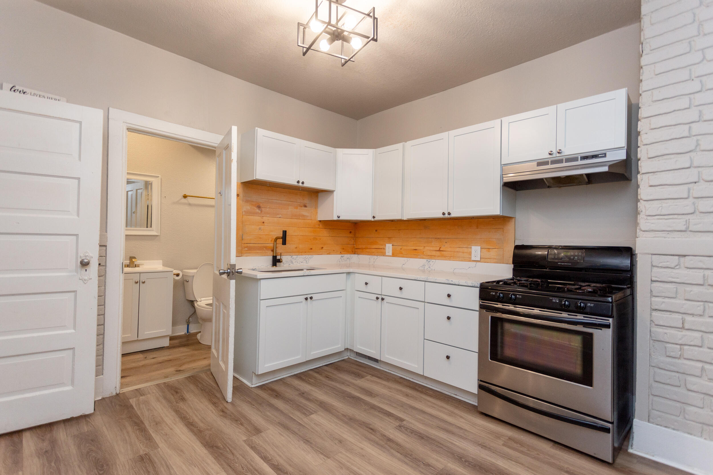 1602 Kentucky Street, Unit 1 Michigan City, IN 46360 - Photo 5 of 13 a kitchen with a stove oven and sink