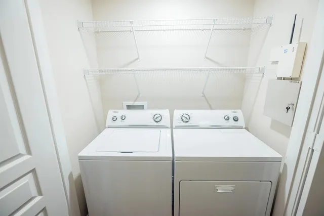 a utility room with dryer and washer
