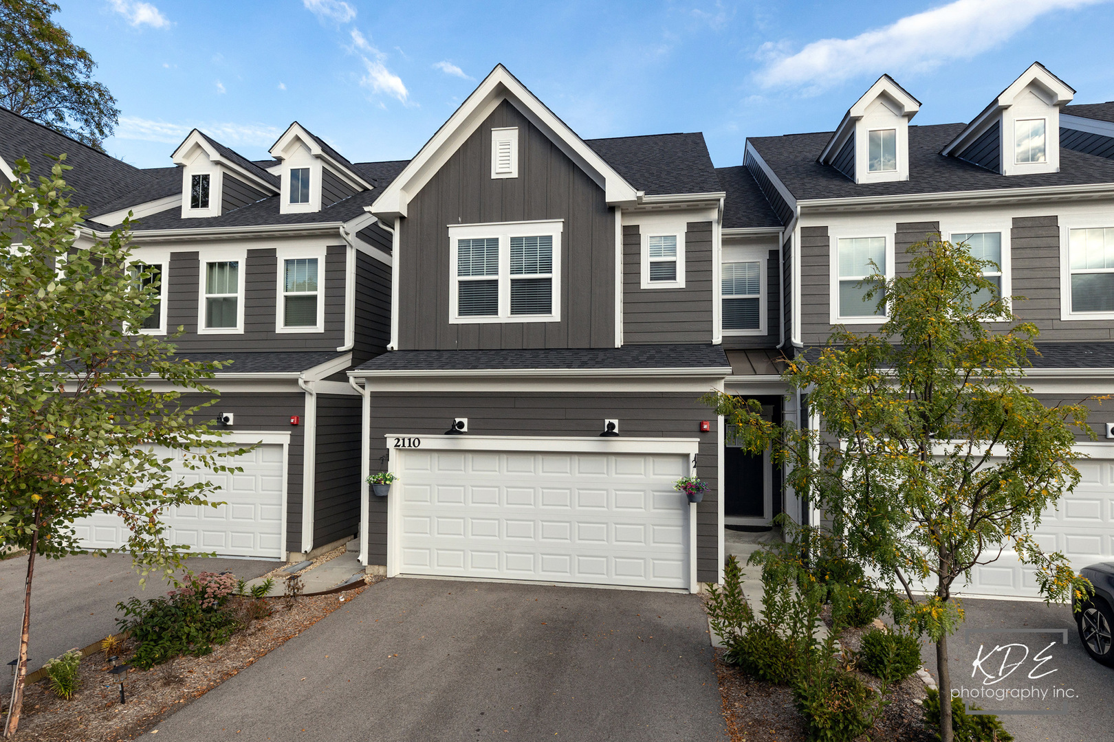 2110 Weatherbee Lane Naperville, IL 60563 - Photo 2 of 32 a front view of a house with a yard and garage