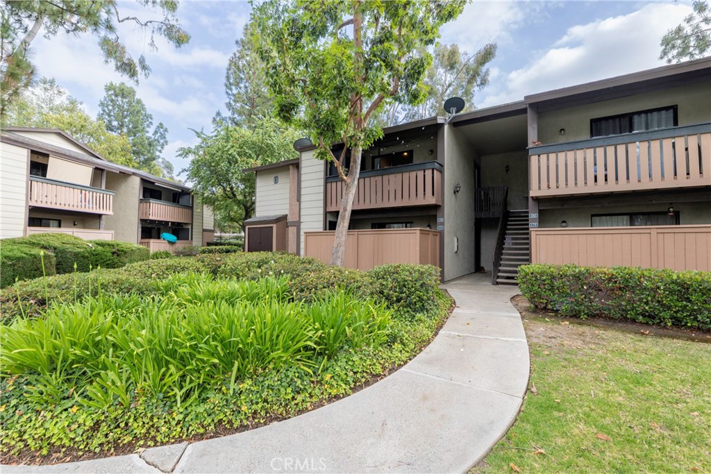20702 El Toro Road, Unit 178 Lake Forest, CA 92630 - Photo 2 of 30 a front view of a house with garden