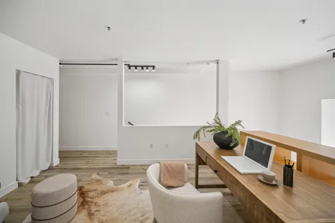 a living room with furniture and a table
