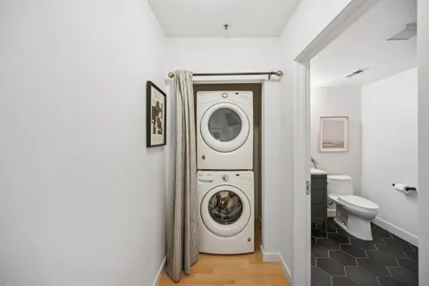 a utility room with sink dryer and washer