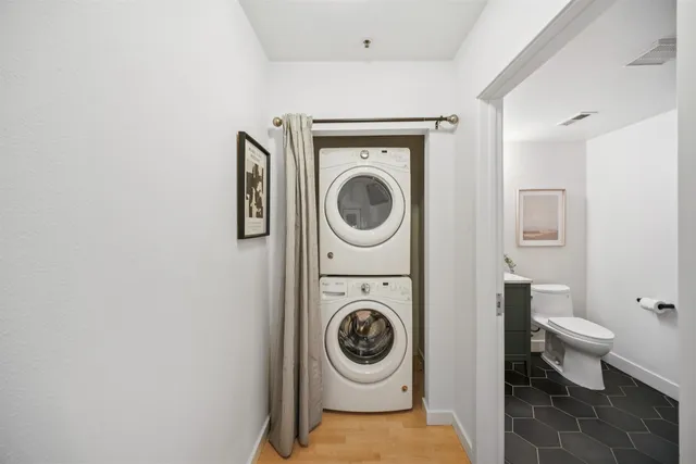 a utility room with sink dryer and washer