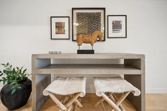 a living room with furniture and flowers