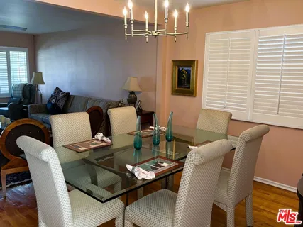 a kitchen with stainless steel appliances granite countertop a sink stove and microwave