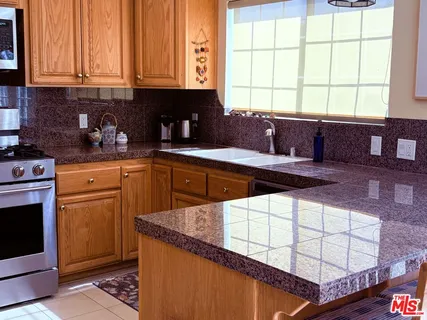 a kitchen with a sink and a window