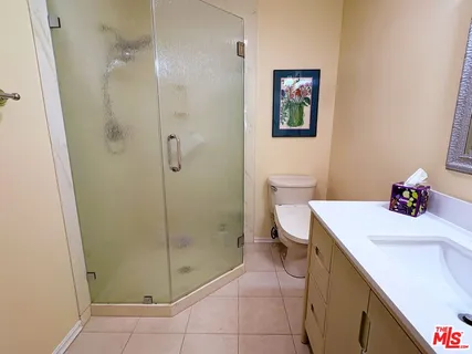 a bathroom with a sink a toilet and vanity
