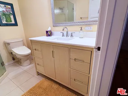 a living room with furniture and white walls