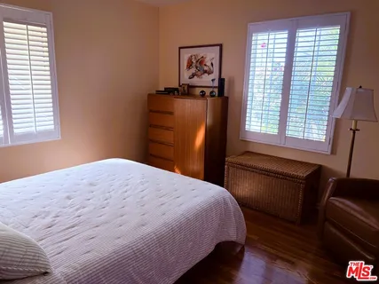 a living room with furniture and a lamp