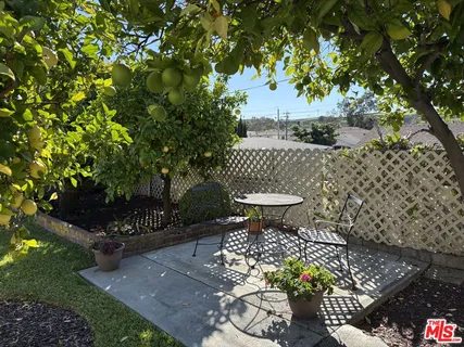 a front view of a house with outdoor space