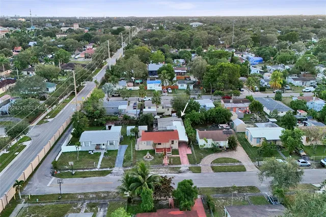 a bedroom with a large bed and a dresser