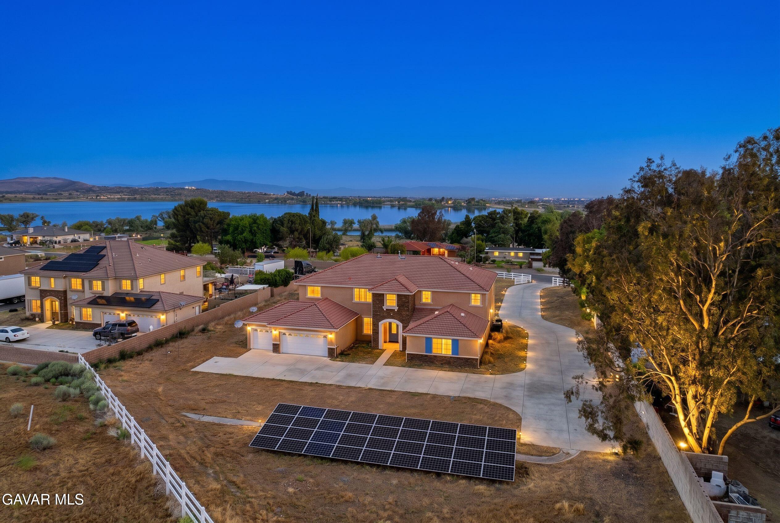 658 Lago Lindo Road Palmdale, CA 93550 - Photo 3 of 91 a view of a swimming pool with an outdoor seating and a garden