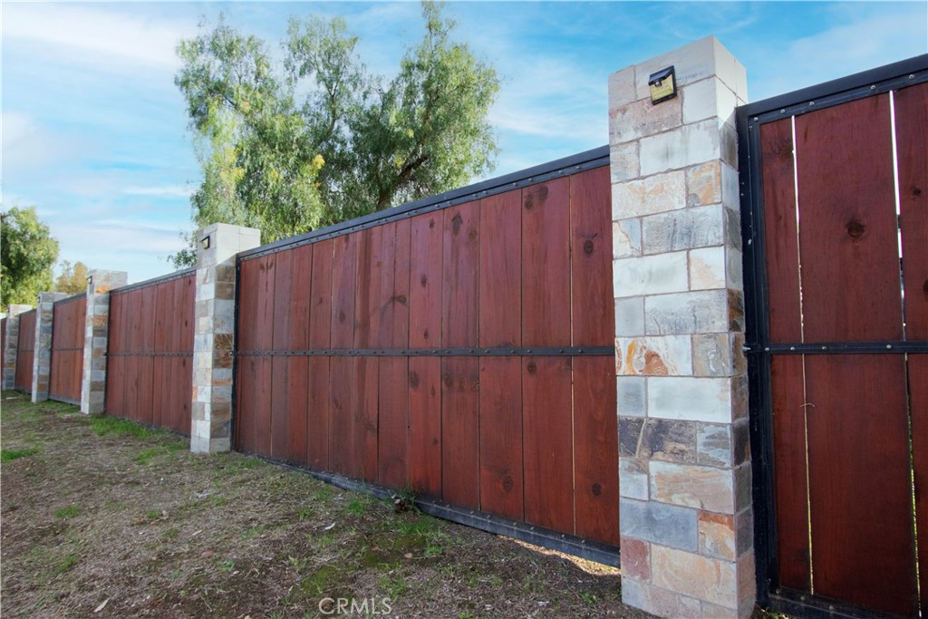 3502 Proctor Valley Road Bonita, CA 91902 - Photo 9 of 22 a view of a backyard with potted plants and wooden fence