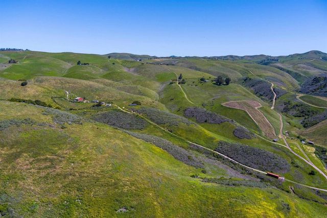a view of a city with mountains in the background