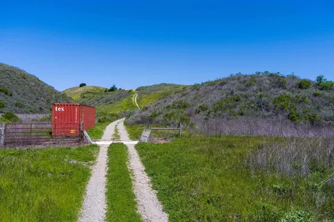 a view of house with a yard