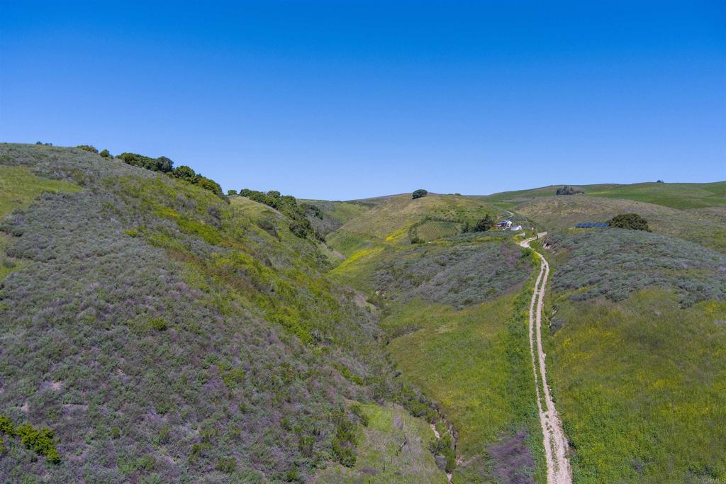 0 Sweeney Road Lompoc, CA 93436 - Photo 9 of 36 a view of a mountain with a field