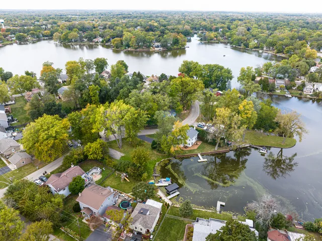 an aerial view of lake residential houses with outdoor space and lake view