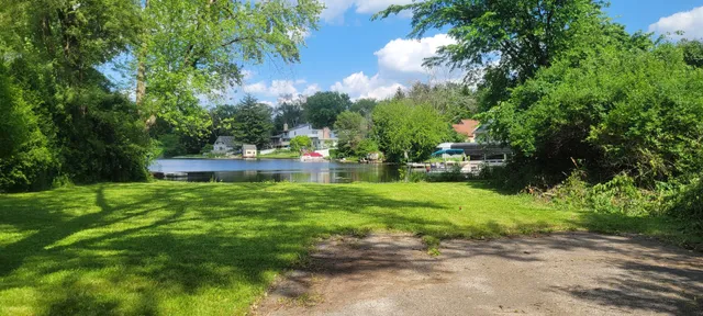 a backyard of a house with lots of green space