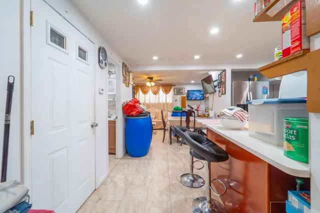 a dining room with furniture a mirror and a window
