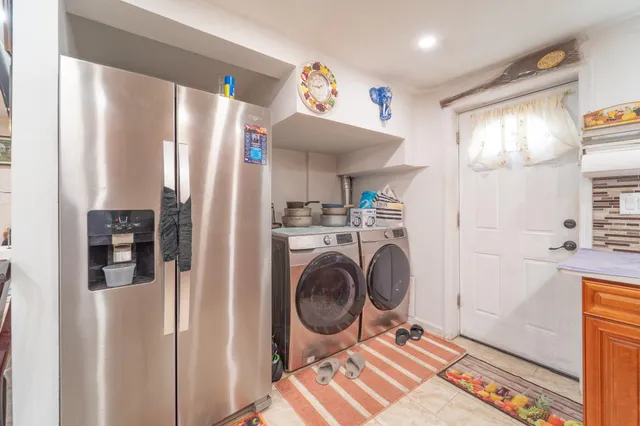 a view of a hallway with washer and dryer