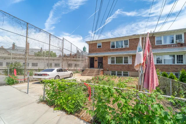 a view of a house with sitting area and garden