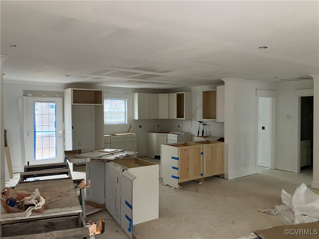 Kitchen with refrigerator and washer and clothes d