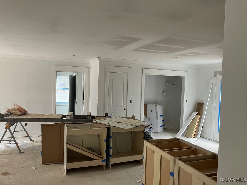 Kitchen with a center island and ornamental moldin
