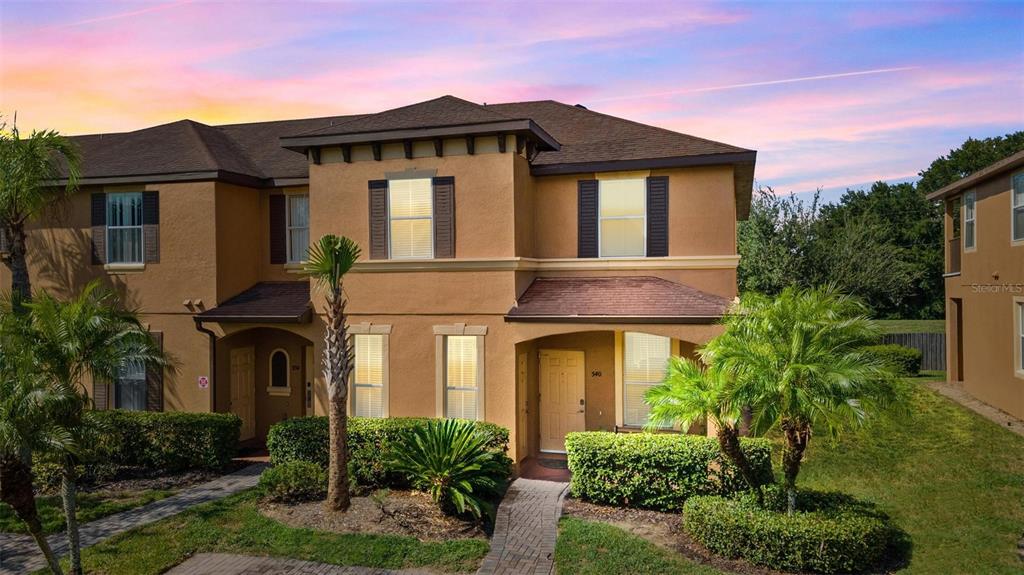 540 Calabria Avenue Davenport, FL 33897 - Photo 1 of 49 a front view of a house with garden