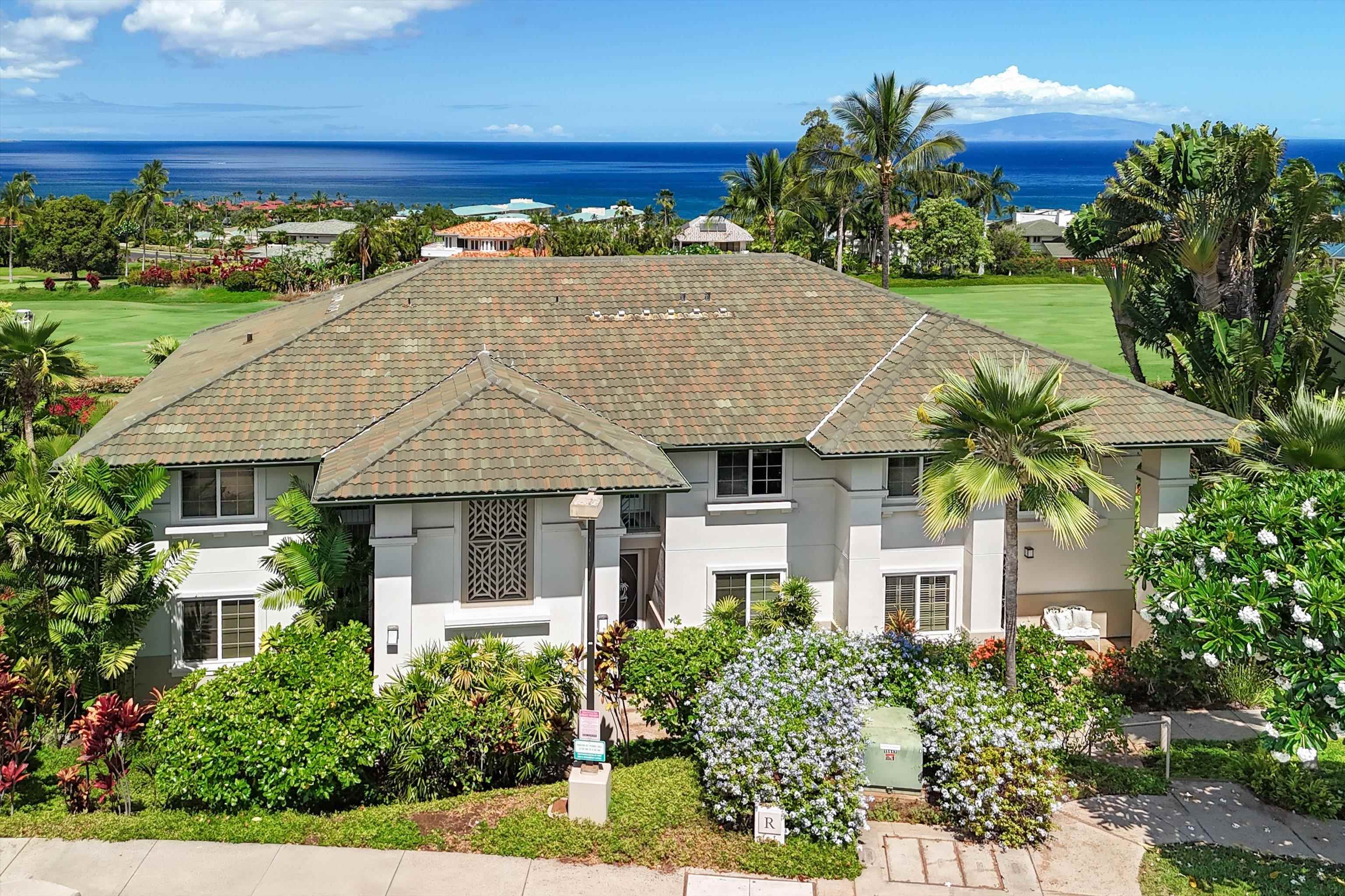 3950 Kalai Waa Street, Unit R 103 Kihei, HI 96753 - Photo 1 of 50 a front view of a house with a yard