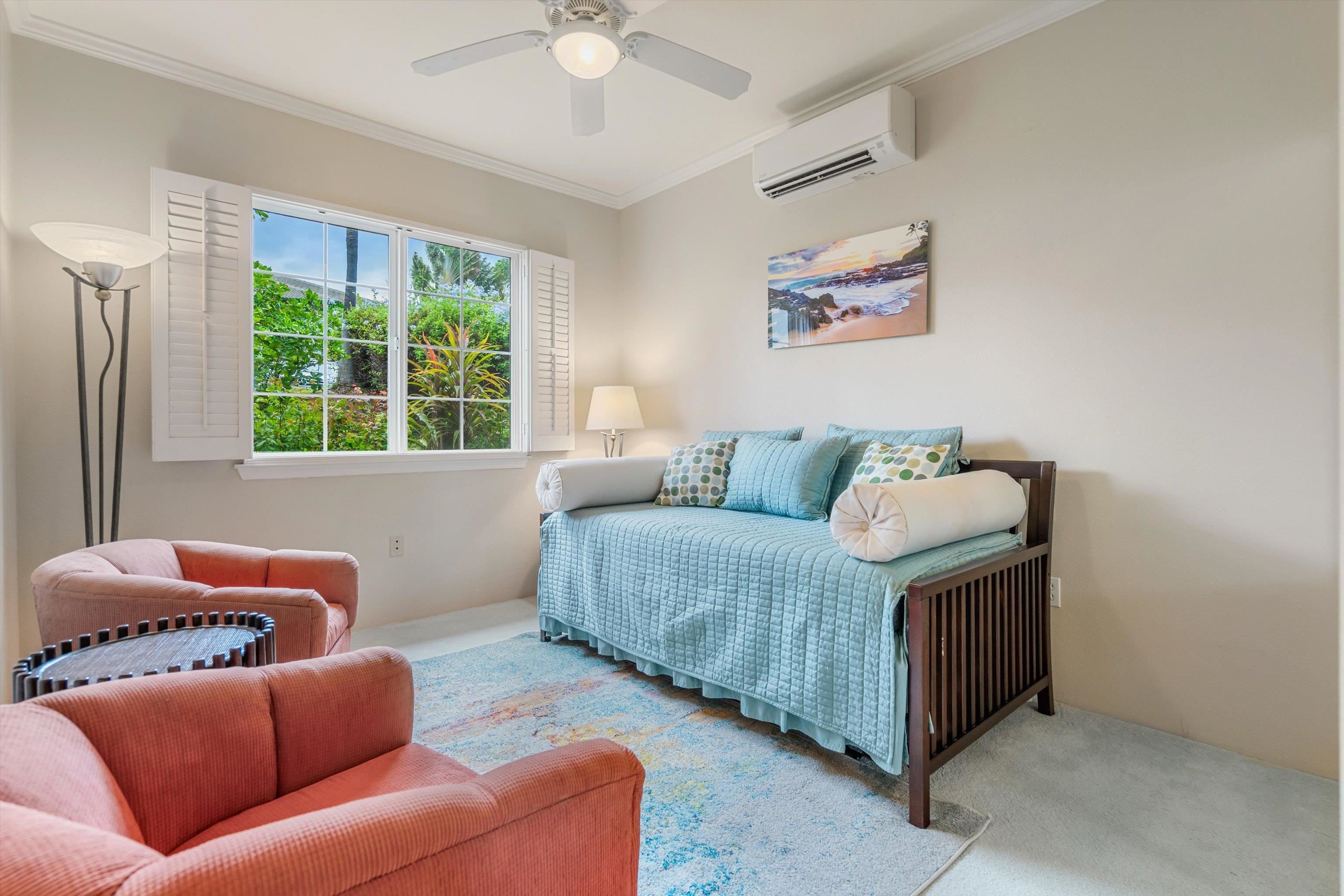 3950 Kalai Waa Street, Unit R 103 Kihei, HI 96753 - Photo 13 of 50 a living room with furniture and a large window