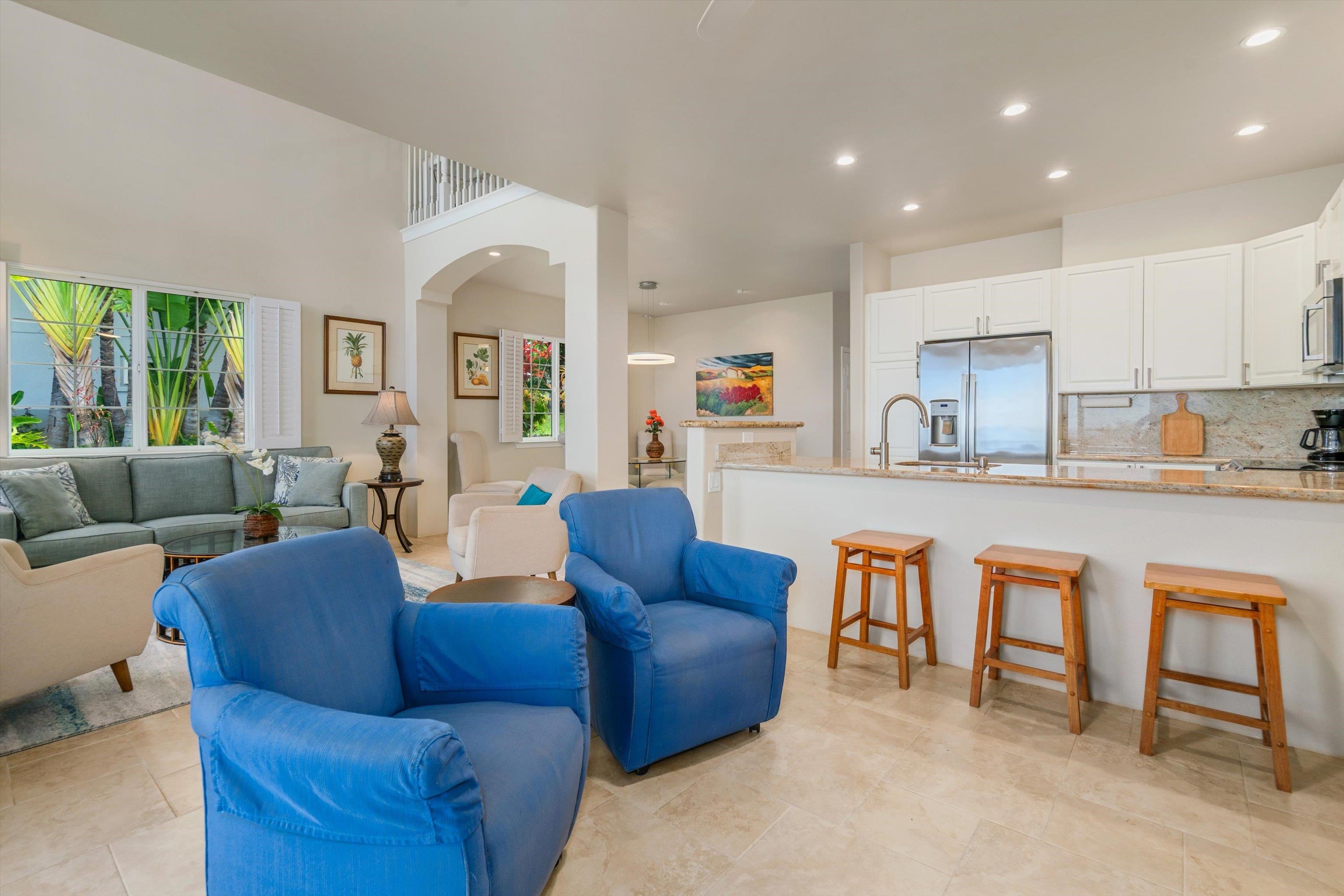 3950 Kalai Waa Street, Unit R 103 Kihei, HI 96753 - Photo 21 of 50 a living room with furniture and a large window