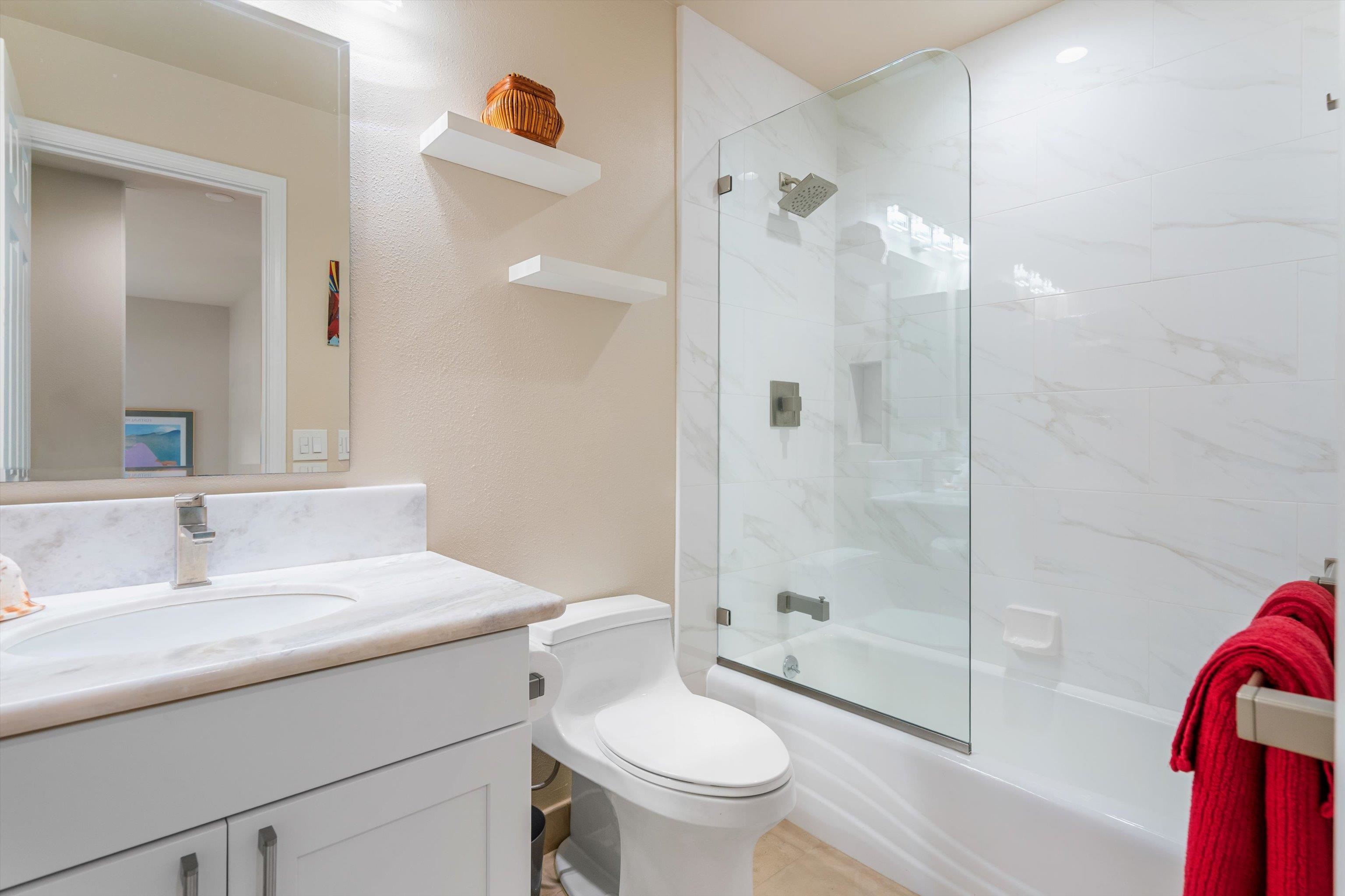 3950 Kalai Waa Street, Unit R 103 Kihei, HI 96753 - Photo 26 of 50 a bathroom with a sink toilet and shower