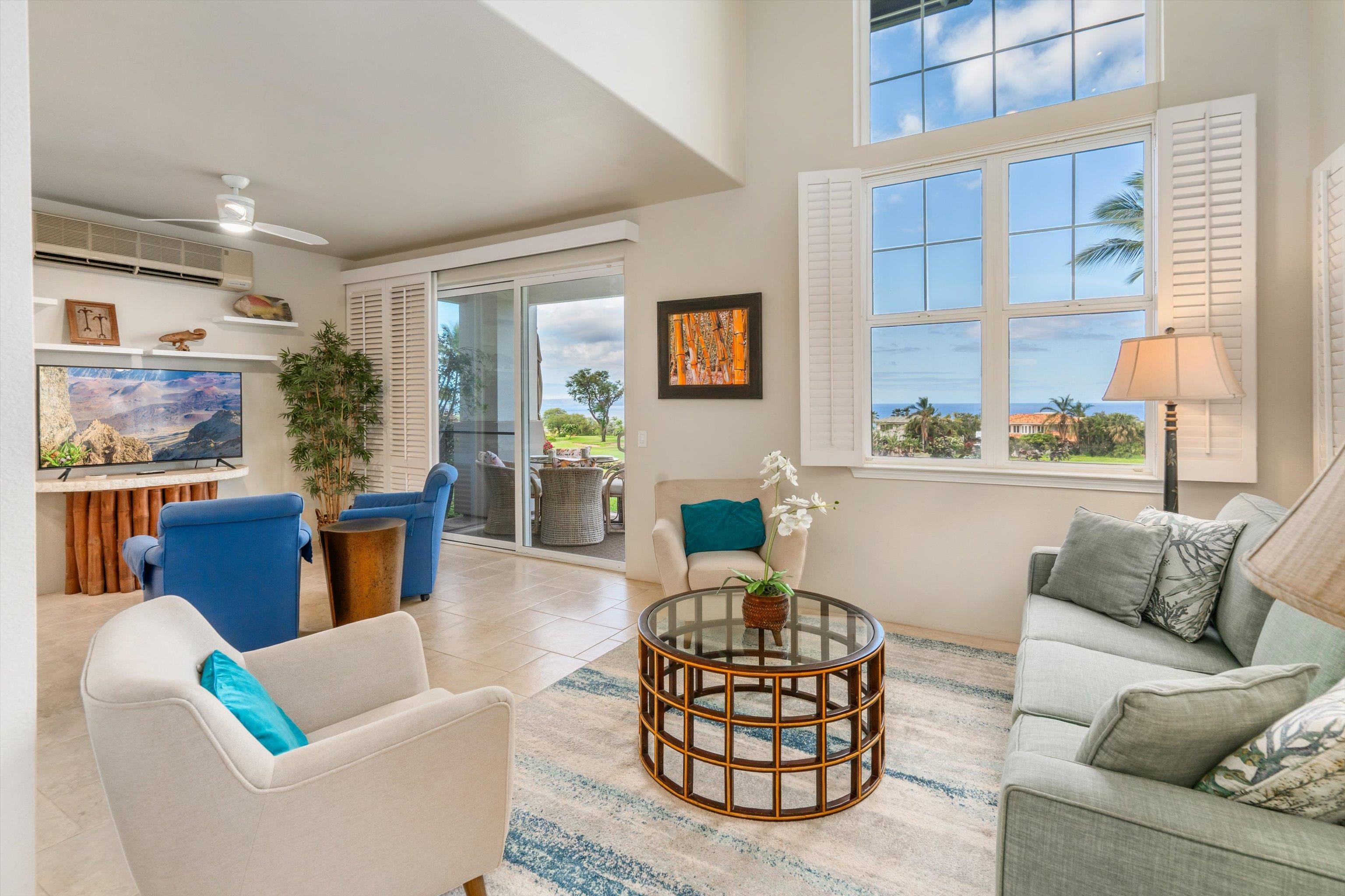 3950 Kalai Waa Street, Unit R 103 Kihei, HI 96753 - Photo 3 of 50 a living room with furniture a rug and a large window