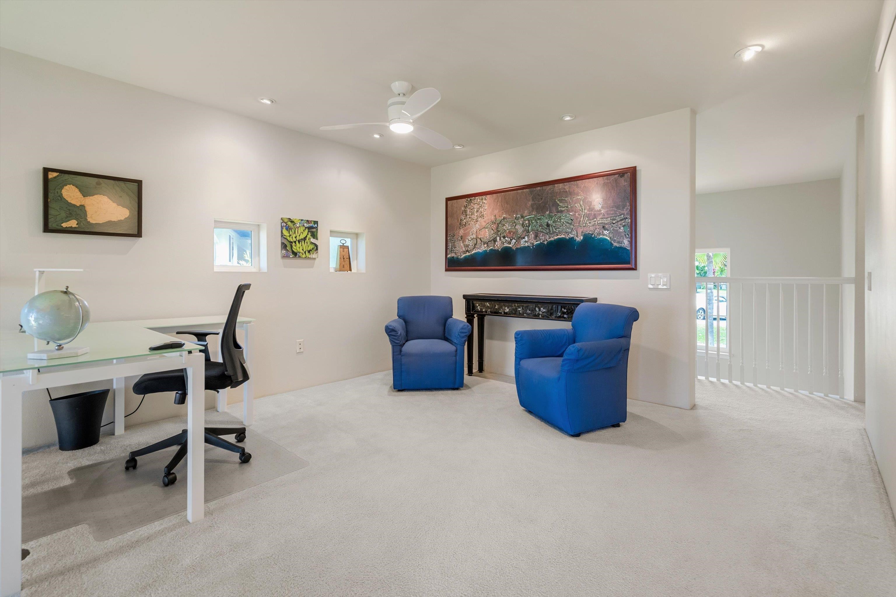 3950 Kalai Waa Street, Unit R 103 Kihei, HI 96753 - Photo 35 of 50 a room with furniture and a flat screen tv