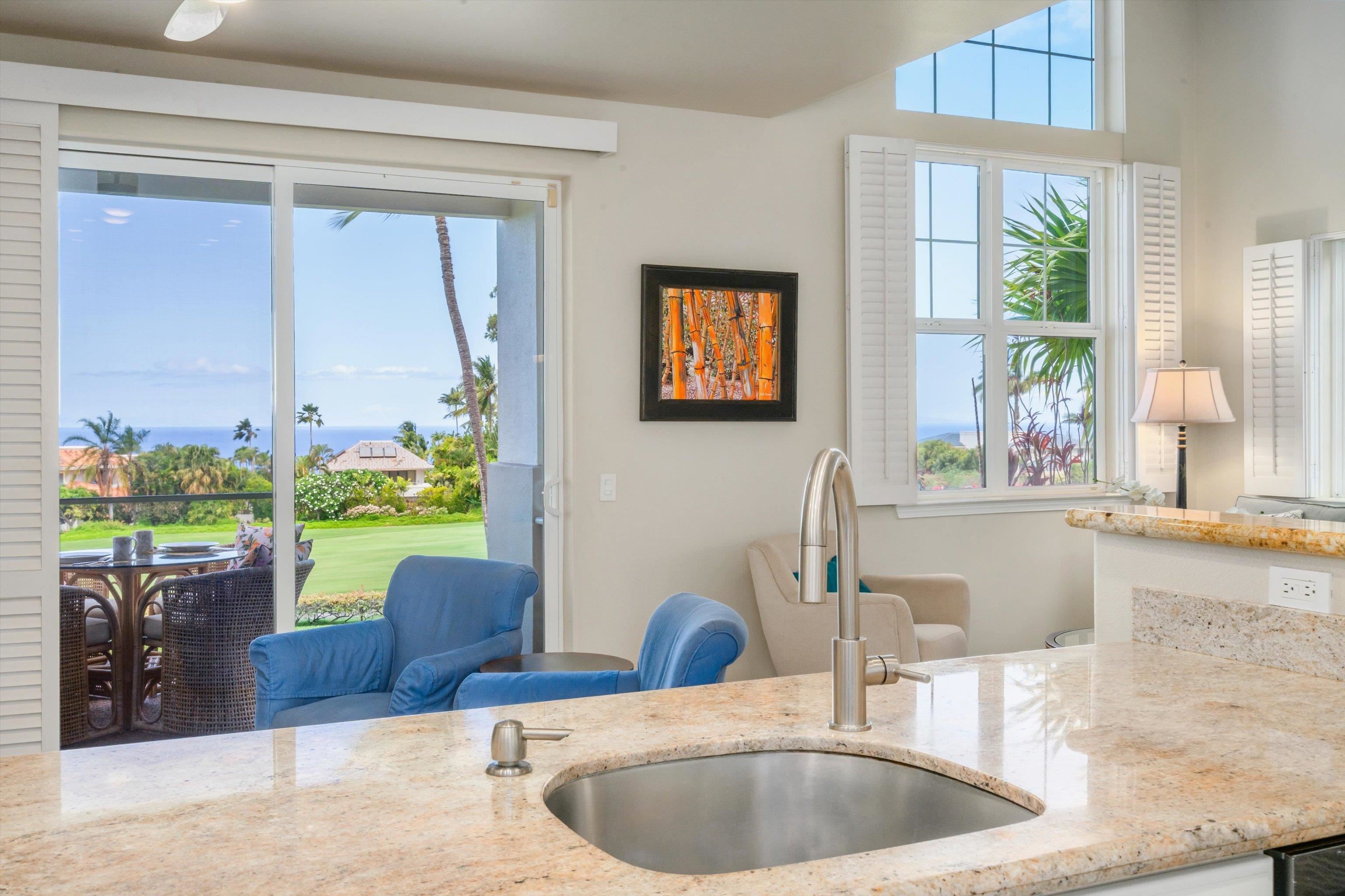 3950 Kalai Waa Street, Unit R 103 Kihei, HI 96753 - Photo 39 of 50 a bathroom with a granite countertop sink and a large mirror